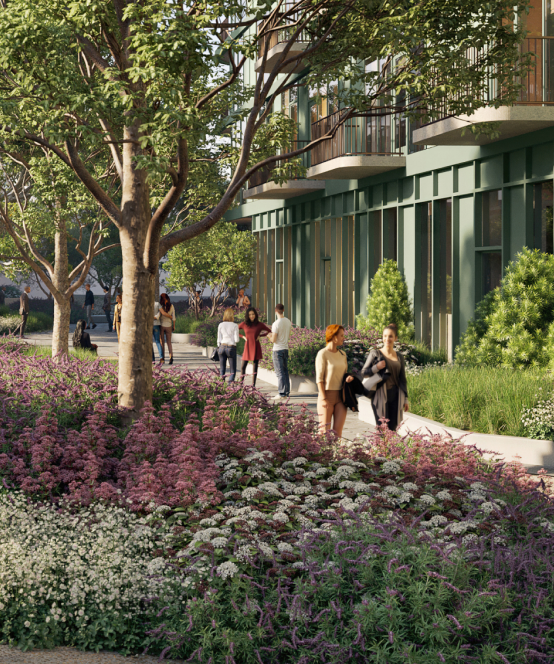 Lush trails weaving along Habitat's apartment building going toward the creative office building