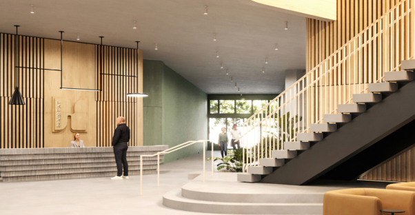 Habitat's large open lobby with wood details and an inviting staircase connecting to the second level